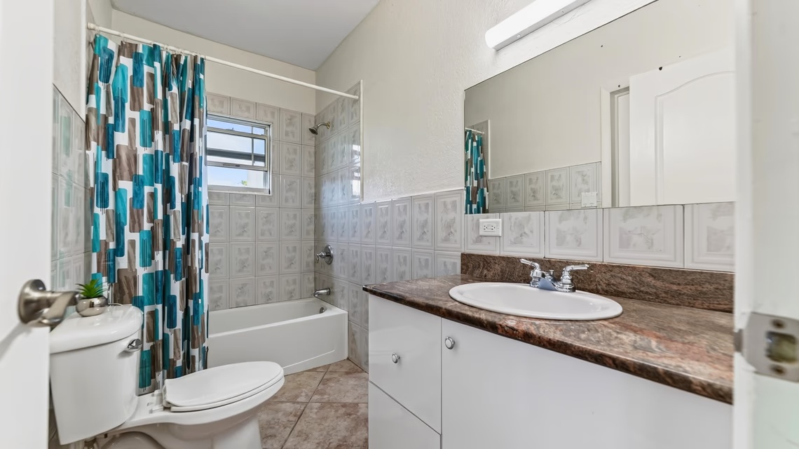 West Bay 2 Bed / 2 Bath Single Family Home With Fenced Yard & Solar Panels
